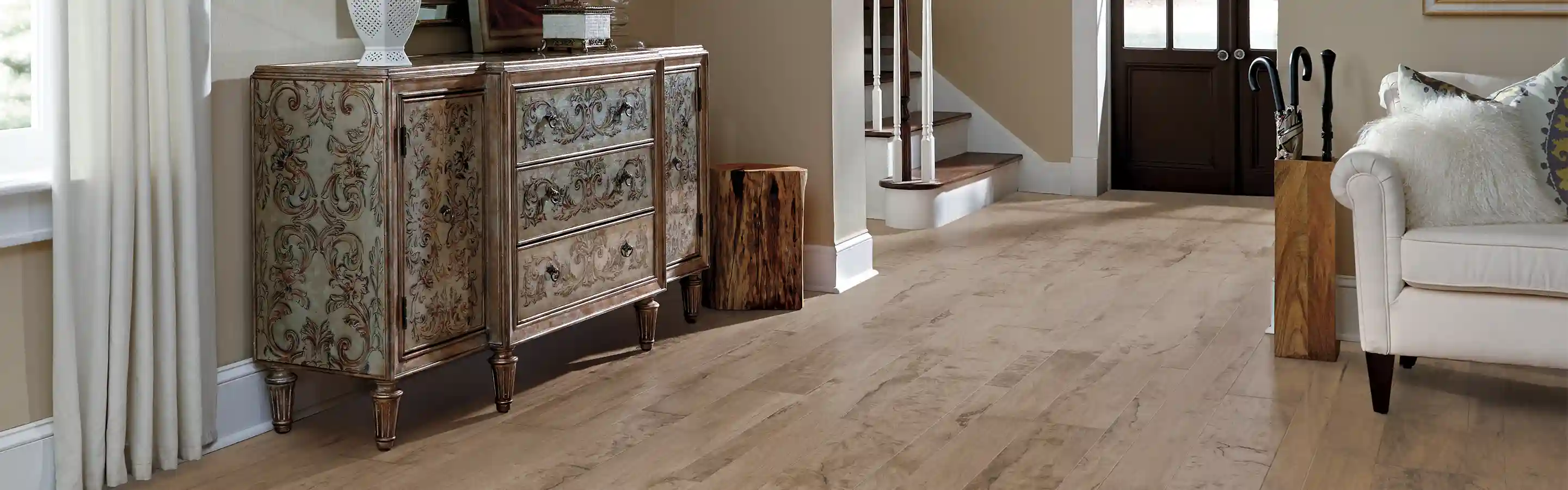 Hardwood floor living room and entryway with stairs 