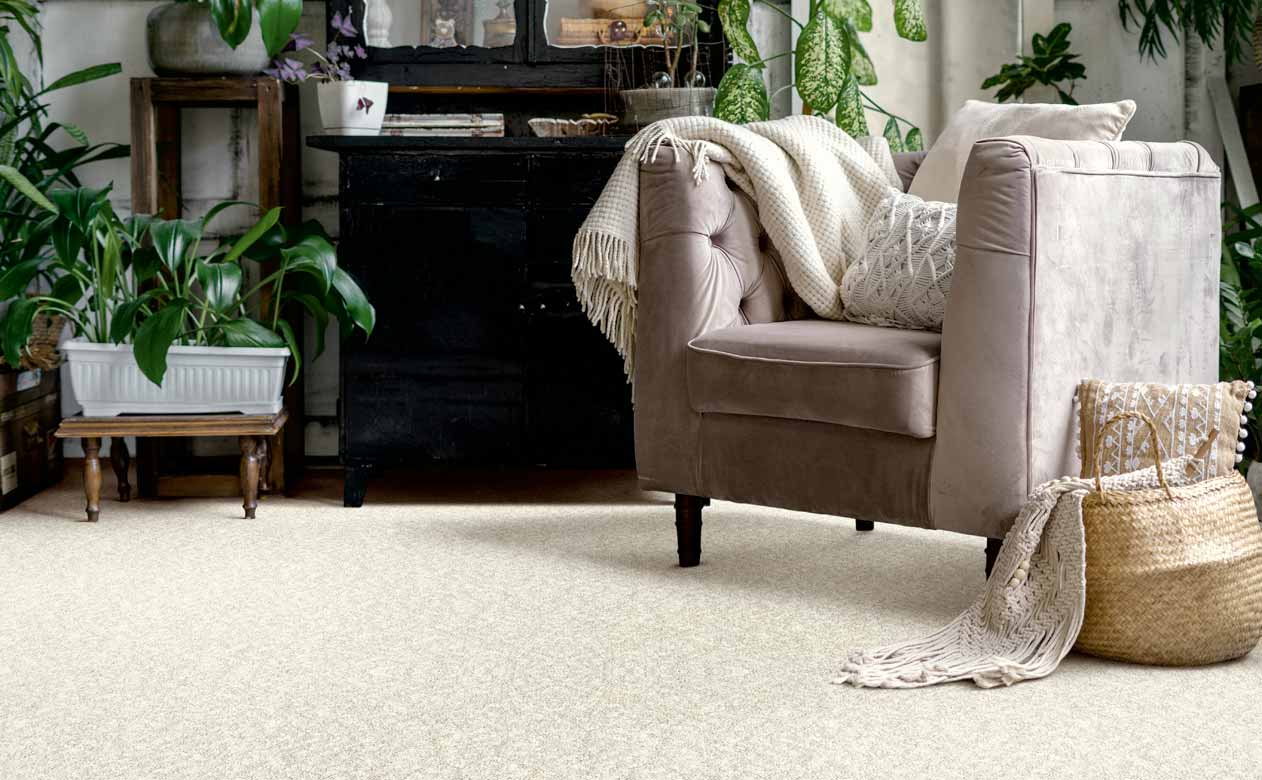 Living room with brown chair,  and cream colored carpet